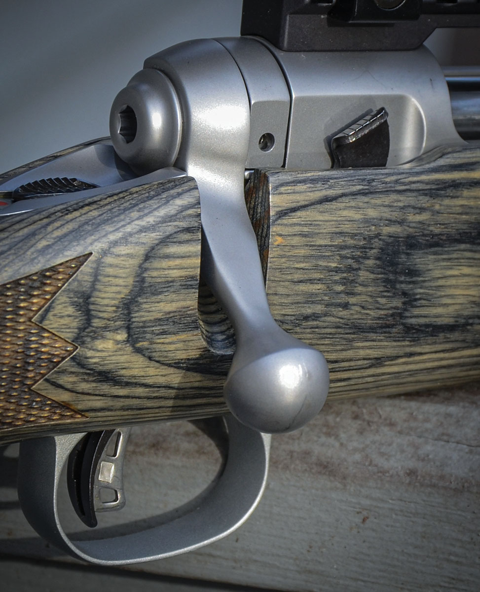 The bolt of the Mark VII action has a Shaw-designed, teardrop-shaped handle rather than the Savage handle. Pressing the tab down on an extension of the sear shown here, just forward of the bolt and holding back the trigger, frees the bolt for removal from the receiver.
